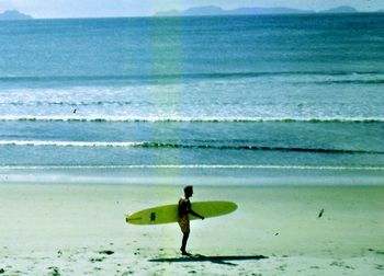 Johnny Bruce cuts a lonely figure on one of those 'cool off' sort of days.... small clean day at Waipu....summer of '65
