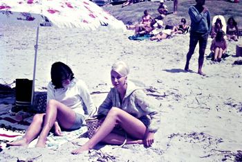 to late...they've spotted a couple!!...the unsuspecting Claire Marinkovich  and friend....... the girls lap up a warm summers day at Waipu Cove 1966
