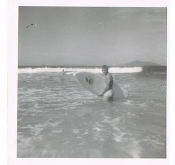 This is a great photo Dosen't this shot look all so virginal and innocent...really captures well the freedom and simple-ness of life back in the late 50s early 60s!!......there was noooo rush....you could have any wave you wanted.......
