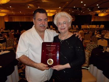 Accepting the Frosini Award on behalf of the Members of the Michigan Accordion Society With Accordionist Composer, Performer and Conductor Joann Cochran Sommers in Las Vegas, NV
