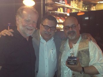 Celebrating Michele Ramo's world music award with Howard Herts president of the Detroit Music Awards
