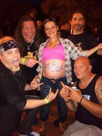 Signing a pregnant lady's stomach after a show with Sebastian Bach
