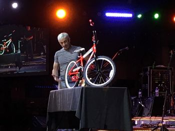 Aaron Tippin Assembles Bike for Toys for Tots
