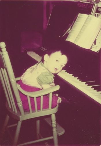 My Show Biz Career Begins: Grandma would tell an unsuspecting guest that I could play by ear, then plop me into my high chair in front of the piano.  Right on cue, I'd mash my ear against the keys, making an awful racket!  I can still hear her laughing.
