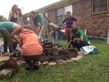 Herb spiral build: dry stacking stone/adding soil
