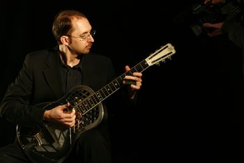 Fernando-Perez-National-Guitar Fernando Perez playing a National Resophonic Guitar
