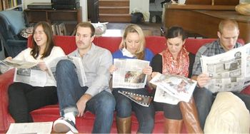 My nieces and nephews reading an actual Newspaper New York Times, Thanksgiving at my parents' house, 2013.
