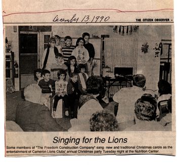 1990_Freedom_Construction_singing_for_the_Lions EK on piano with Freedom Construction kids at the Lion's club.
