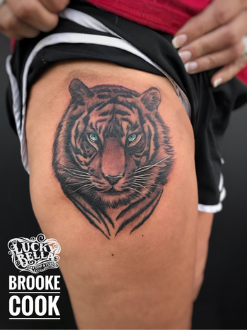 Black and Grey Tiger with Blue Eyes by Brooke Cook at Lucky Bella Tattoos in North Little Rock, Arkansas
