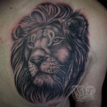 Black and Grey Lion on Chest by Howard Neal at Lucky Bella Tattoos in North Little Rock, AR

