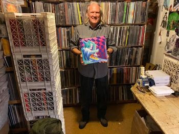Anthony Ausgang at Zion’s Gate Records in Seattle displaying the MGMT cover he designed
