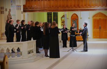 Matthew Quinn conducts Cappella Caeciliana at the TWO CITIES concert in St Malachy's Church, Belfast, on 28/1/23. Photographer Vincent McLaughlin
