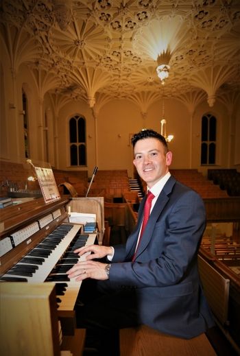 St Malachy's 14 More than Gold concert in St Malachy's Church Belfast: Organist and composer Niall Leonard with the magnificent ceiling of St Malachy's Church in the background. Photo by Vincent McLaughlin
