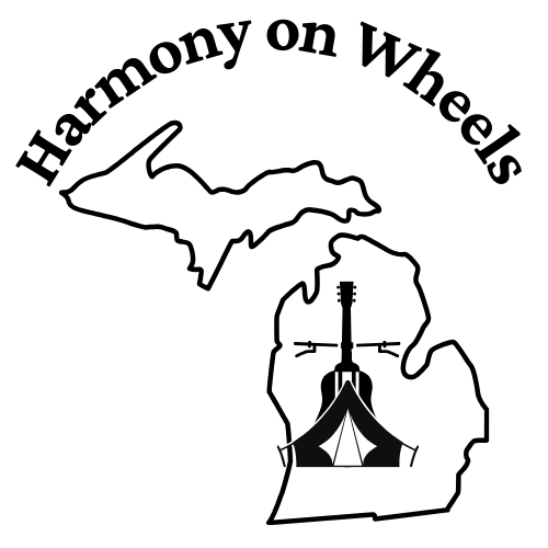 The words Harmony on Wheels arcs over an outline of the state of Michigan. Within the mitten is a composit of an acoustic guitar, a bicycle and a tent.