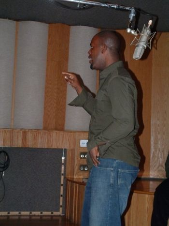 Marshan Directing the choir At Different Fur Recording Studio
