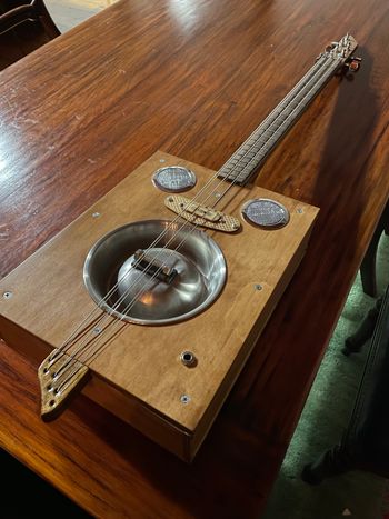 Brian’s Dog bowl cigar box.  It’s a 6 stringer, but strung double in 3 courses  (like a 12 string guitar).  It’s got a fascinating retro sound, reminding me of classic Blind Willie McTell stuff
