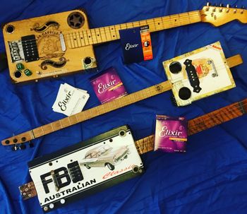 Flanked by the ‘Box & Dice’ and ‘FB Classic’ - the little 3 string ‘Salty Dog’ cigarbox, makes it’s appearance - built  by Steve Plater from Ballarat.  All strung with quality Elixir Strings, of course!
