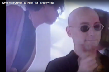 Niko, Nelson  and Lyndon 1995 From the "Toy Train" music video, from "Trapped in the Machine"
