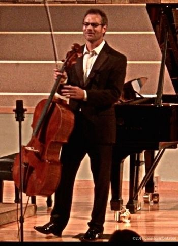 Cellist, Daniel Gaisford in Las Vegas  / Announcing the program.
