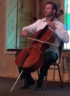 American Cellist, Daniel Gaisford performing at a service
