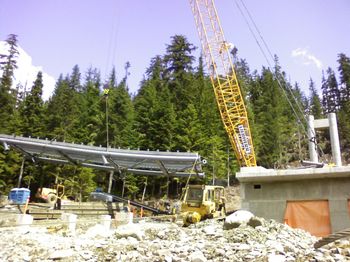 The big Liebherr crane would then unload it and put it in place.  The crane had a 400 foot reach.  It was on tracks and was so wide it had no outriggers, just a huge counterweight.  I had to pull it up to the top with the D8 cat.
