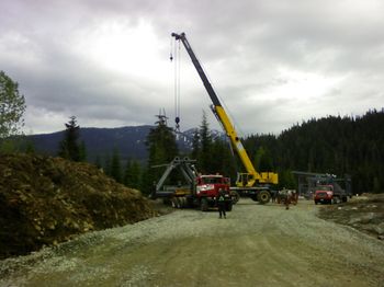 21June2007 <> This was as far as the truck could get … it was then loaded onto a heavier duty truck and I would use the 16 grader to help pull it up the steep grade to the top of the ski jump
