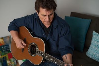 A Man and His Couch With my snazzy Ovation Glen Campbell USA model made in West Hartford, CT.
