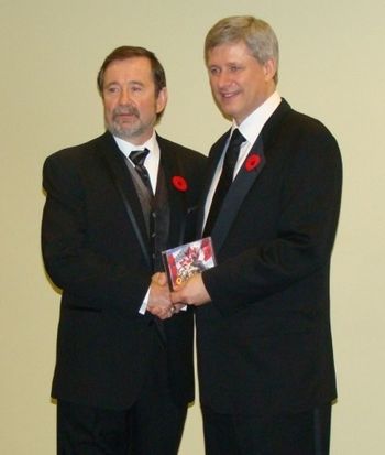 Dennis presenting a commemorative CD to Prime Minister Stephen Harper
