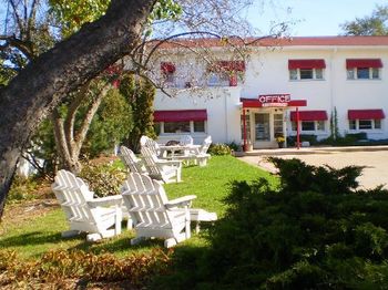 Our grounds feature a picnic area with adirondack chairs, a picnic table, and a campfire pit available for guest use.
