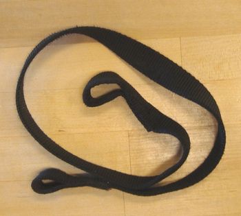 Nylon strap with a 2" loop on one end and a 1' loop on the other. Check to be sure your lead fits through the smaller loop.
