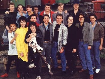 From the "J.A.M. '86" charity record, "We've Got The Love."  E Street Band members Garry Tallent (3rd from right) co-produced, and Max Weinberg (2nd from right) played drums.
