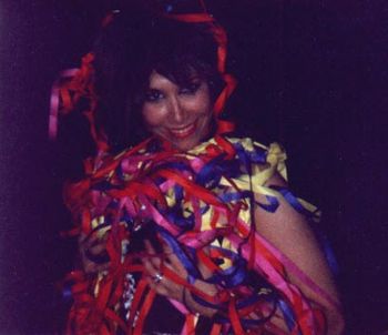Carolyne says this was, "The end of the German tour in Dec. 1990. They released confetti and streamers during the encore, 'Come Together.' I wore my Tina Turner wig. That wig was funny. No one recogni
