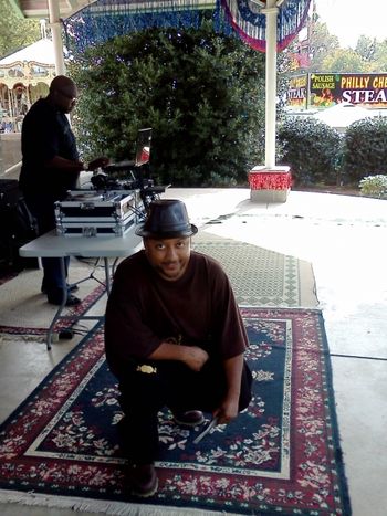 J.O.T. aka GRANDE GATO GETTING READY TO PERFORM AT THE 2012 DIXIE CLASSIC FAIR(BLACKSMITH DJ in the background).

