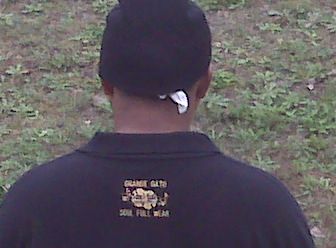 J.O.T. in BLACK polo style SOUL-FULL WEAR shirt with logo(back view)
