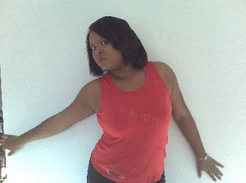 MS. CRYSTAL aka BONITA SENORITA wearing red LADY SOUL sleeveless shirt
