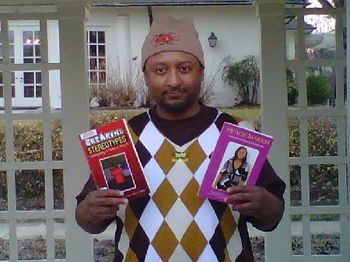 J.O.T. aka GRANDE GATO at REYNOLDA holding two of three books published from SOUL-FULL.
