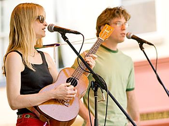 LInda on baritone ukulele, with Matt Robbins on vocals.
