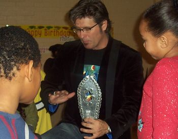 Demonstrating some percussion to the kids
