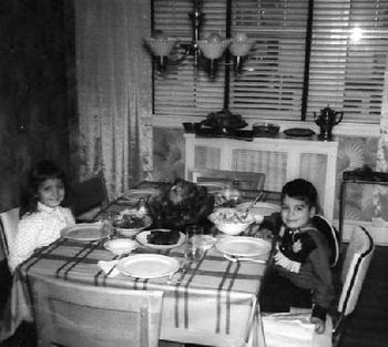 Cowboy Eddie and Miss Priss Joyce, getting ready to chow down.~Philly, Pa.  It looks dark outside & Joyce is still in jammies. Makes me think I probably been wearing this get-up all day, or she was to
