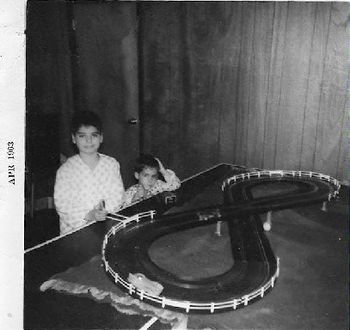 Me and bro Mike making many left hand turns.  Mike, can you look more bored?  They don't make race car sets like that anymore! (Eldon) See the ping pong ball under the overpass?  Dad finished this bas
