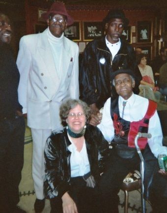 Meeting the elders: singerJesse Fortune, in white, with Larry Taylor; Detroit Junior, piano entertainer, red vest,  Chicago Blues Exchange downtown 2004
