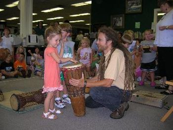 A young drummer feels the One Heartbeat
