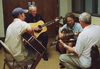 Ras Alan pickin with family
