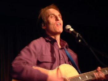 Crooning his crowd rousing song, "Treasures," at Makor NYC. How about those phantom, fast-as-lightning, see-through guitar hands?
