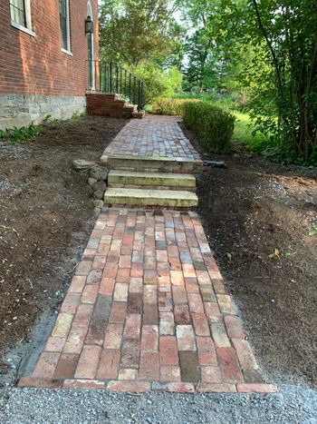 Brick walkway with marble steps
