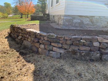 Retaining wall using stone found on property
