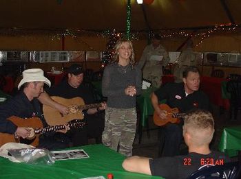 Entertaing troops at a chowhall in Kuwait with Storm Rhodes, Mike Rogers, and Jolie Edwards.
