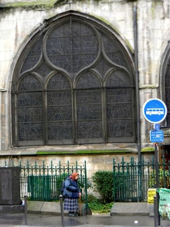 As we approached the Latin Quarter in Paris on Sunday morning, I snapped this photo of a woman leaving a Greek Orthodox Church.  We had just gotten out of the Mass at Notre Dame, nearby.
