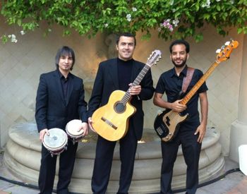 Marco Tulio Trio (left to right): Paul Gonzalez (percussion), Marco Tulio (guitar), Andre de Santanna (bass). (Laguna Beach, CA - 2013)
