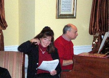 Rossi Christmas party: Eileen leads the Christmas sing-a-long, Jordan's at the piano
